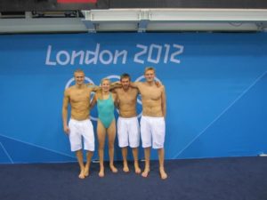 Lietuvos plaukikų komanda Londono olimpinėse žaidynėse. Mindaugas Sadauskas (pirmas iš kairės), Rūta Meilutytė, Vytautas Janušaitis, Giedrius Titenis